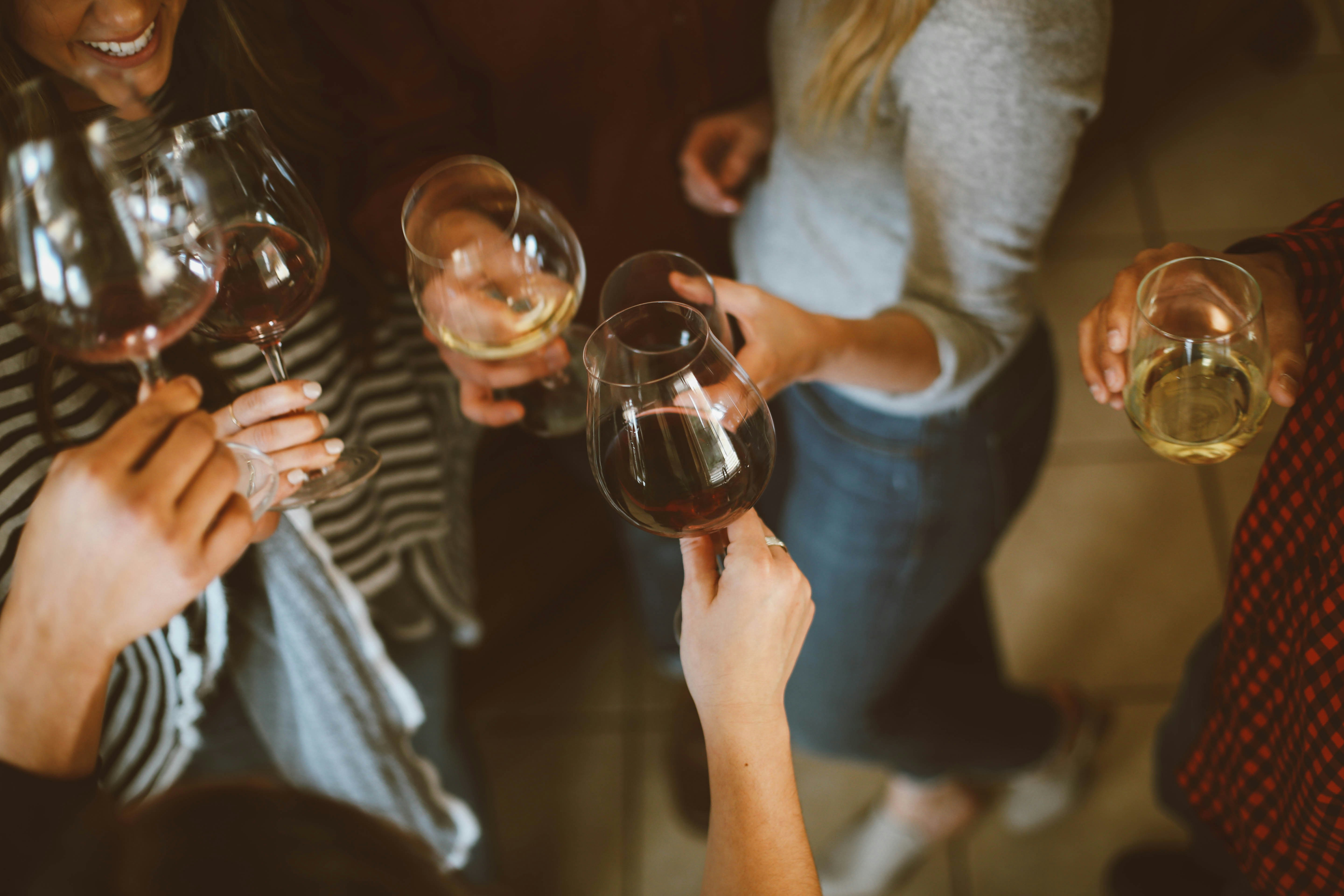 Wine tasting scene with white and red wines — exploring what are sulphites in wine and their role in winemaking